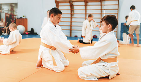 kids showing repsect in jiu jitsu class